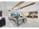 Open-concept living area with a view of the kitchen and modern furnishings at 5688 Flame Vine Way, St Cloud, FL 34771