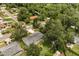 This aerial view shows the home's setting amongst a lush, green neighborhood of mature trees at 575 Lake Mccoy Dr, Apopka, FL 32712