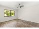 Inviting bedroom features wood floors, ample natural light, and a ceiling fan at 575 Lake Mccoy Dr, Apopka, FL 32712
