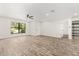 Bright living room featuring modern flooring, recessed lighting, ceiling fan and open layout at 575 Lake Mccoy Dr, Apopka, FL 32712
