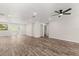 Spacious living room with modern flooring, recessed lighting, and a ceiling fan at 575 Lake Mccoy Dr, Apopka, FL 32712