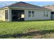 A screened-in lanai and generous yard provide ample outdoor living space at 577 Talisi Loop, St Cloud, FL 34771