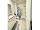 Clean and functional bathroom featuring a tub/shower combination, granite vanity, and tiled flooring at 577 Talisi Loop, St Cloud, FL 34771