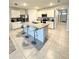A kitchen island with barstool seating provides added space at 577 Talisi Loop, St Cloud, FL 34771