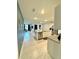 Modern open-concept kitchen with granite countertops and stainless steel appliances at 577 Talisi Loop, St Cloud, FL 34771