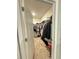 Organized walk-in closet with shelving, hanging racks, and ample storage space for clothes and shoes at 577 Talisi Loop, St Cloud, FL 34771