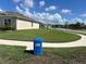 The property features a lush lawn extending to the street with sidewalks at 577 Talisi Loop, St Cloud, FL 34771