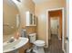 Half bathroom showcasing toilet and sink at 6839 Hidden Glade Pl, Sanford, FL 32771