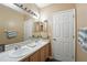 Bathroom showcasing double sinks and vanity at 6839 Hidden Glade Pl, Sanford, FL 32771