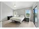 Relaxing bedroom with neutral tones, desk, and access to a private outdoor area featuring a pool at 6839 Hidden Glade Pl, Sanford, FL 32771