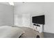 Spacious bedroom featuring a TV, closet, and neutral tones creates a comfortable and inviting retreat at 6839 Hidden Glade Pl, Sanford, FL 32771