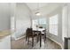 Eat-in kitchen dining area with a dark wood table and chairs, pendant lighting and a view of the backyard at 6839 Hidden Glade Pl, Sanford, FL 32771
