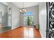 Spacious dining room featuring a large window, hardwood floors, and ample natural light at 6839 Hidden Glade Pl, Sanford, FL 32771