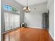 Bright and airy dining room featuring hardwood floors and a large window for natural light at 6839 Hidden Glade Pl, Sanford, FL 32771
