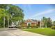 Beautiful single-story home boasting a circular driveway and well-maintained landscaping at 6839 Hidden Glade Pl, Sanford, FL 32771
