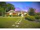 Charming single-Gathering home featuring a lush garden, manicured lawn, and inviting curb appeal at 6839 Hidden Glade Pl, Sanford, FL 32771
