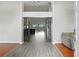 Elegant foyer featuring hardwood floors, high ceilings, and an open view to the living area at 6839 Hidden Glade Pl, Sanford, FL 32771