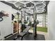 Home gym featuring modern exercise equipment, rubber flooring, and custom lighting, promoting fitness at 6839 Hidden Glade Pl, Sanford, FL 32771