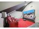 Home theater featuring red lounge seating, a projector screen, and built-in speakers at 6839 Hidden Glade Pl, Sanford, FL 32771
