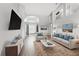 Bright living room with soaring ceilings, neutral tones, and stylish furnishings provides a welcoming atmosphere at 6839 Hidden Glade Pl, Sanford, FL 32771