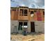 Image shows a townhome in progress, highlighting the block foundation and the start of the wooden framing at 15058 Grove Lake Dr, Winter Garden, FL 34787