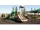 A modern playground with multiple slides and play structures for enjoyment at 3019 Maloof Dr, Davenport, FL 33837