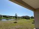 Lush backyard with pond view, perfect for relaxing and enjoying nature in a residential setting at 4113 Sagefield Dr, Harmony, FL 34773