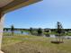 Expansive backyard view with a serene pond, showcasing a peaceful outdoor living space at 4113 Sagefield Dr, Harmony, FL 34773