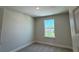 Cozy bedroom with carpet flooring and bright window offering a pleasant view at 4113 Sagefield Dr, Harmony, FL 34773