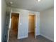 Comfortable bedroom features carpet, neutral walls, and convenient access to closet and ensuite at 4113 Sagefield Dr, Harmony, FL 34773