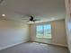 Bedroom features a ceiling fan, recessed lighting, and a large window at 4113 Sagefield Dr, Harmony, FL 34773