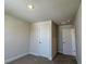 Neutrally painted bedroom with carpeted floor and paneled doors at 4113 Sagefield Dr, Harmony, FL 34773