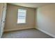 Carpeted bedroom with light walls and a window for natural light at 4113 Sagefield Dr, Harmony, FL 34773