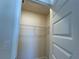 A walk-in closet with wire shelving is shown in this well-lit room at 4113 Sagefield Dr, Harmony, FL 34773