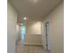 Hallway view with neutral walls and carpet, featuring recessed lighting and doorways at 4113 Sagefield Dr, Harmony, FL 34773