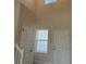 Bright and spacious hallway features high ceilings and natural light from window at 4113 Sagefield Dr, Harmony, FL 34773