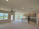 An open-concept living space features lots of light with carpeted and tiled flooring, ready for personalization at 4113 Sagefield Dr, Harmony, FL 34773