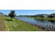 Wide angle of a tranquil pond in a residential area, showcasing natural beauty and community at 4113 Sagefield Dr, Harmony, FL 34773