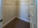 Walk-in closet with metal shelving and neutral carpeting at 4113 Sagefield Dr, Harmony, FL 34773