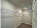 Walk-in closet with wire shelving, providing ample storage space, perfect for organization at 4113 Sagefield Dr, Harmony, FL 34773
