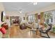 Spacious living room offers ample natural light, comfortable seating, and an open layout for gatherings at 4738 St Andrews Arc, Leesburg, FL 34748