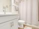 Cozy bathroom with a shower, vanity, and framed artwork at 5724 Camilla St, St Cloud, FL 34771