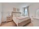 Bedroom showcases natural light, a comfy bed, and neutral decor creating a peaceful space at 5724 Camilla St, St Cloud, FL 34771