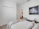 Inviting bedroom featuring soft carpet, a neutral color scheme, and a closet with double doors at 5724 Camilla St, St Cloud, FL 34771