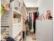 Walk-in closet with custom shelving and ample space for organization at 5724 Camilla St, St Cloud, FL 34771