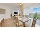 Dining area featuring large windows, neutral tones and modern decor at 5724 Camilla St, St Cloud, FL 34771