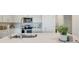 Bright kitchen features stainless appliances, white cabinetry, and modern countertops at 5724 Camilla St, St Cloud, FL 34771