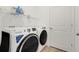 Well-lit laundry room featuring a modern washer and dryer set at 5724 Camilla St, St Cloud, FL 34771