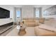 Bright living room showcasing a comfortable beige sectional sofa, modern decor, and stylish accents at 5724 Camilla St, St Cloud, FL 34771