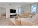 Bright living room with stylish decor, modern fireplace, and plenty of natural light at 5724 Camilla St, St Cloud, FL 34771